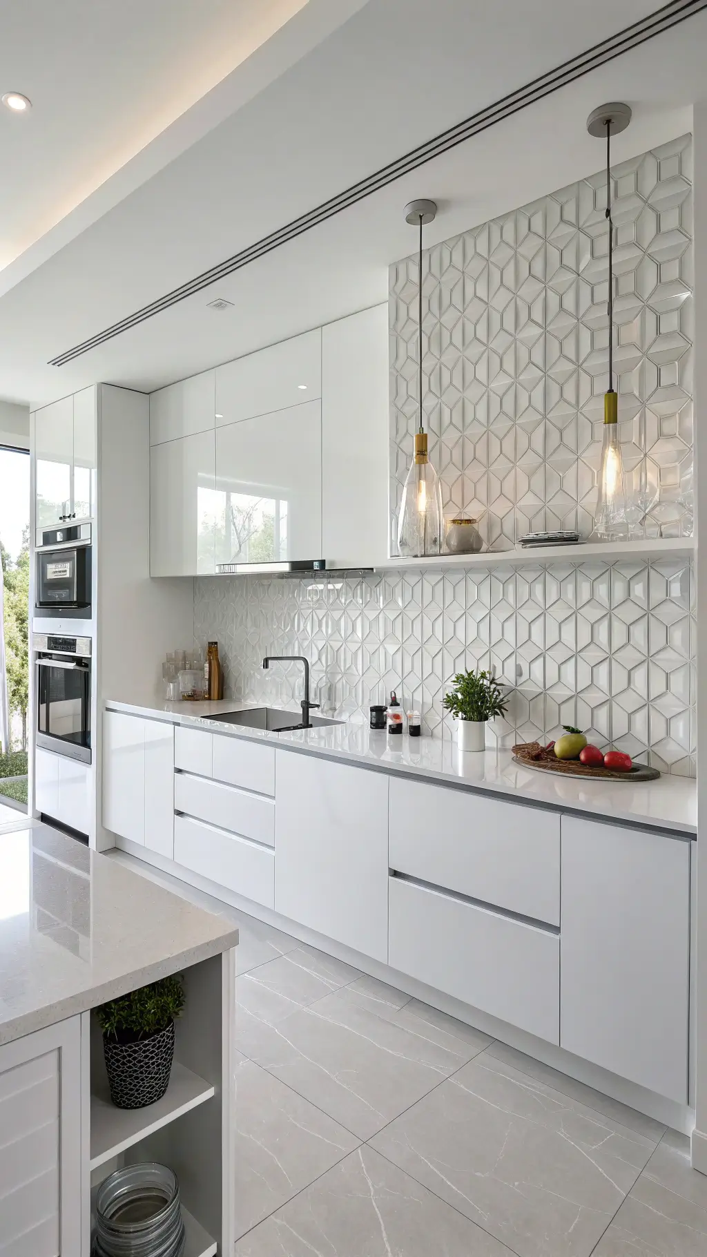 Modern minimalist kitchen with white geometric tile backsplash, high-gloss white cabinets, brushed nickel pendant lights, and monochromatic accessories on floating shelves